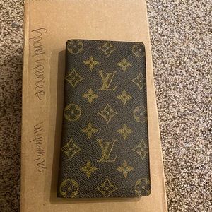 LV checkbook cover.
